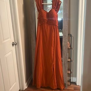 Terecotta bridesmaids evening gown with off the shoulder and slit